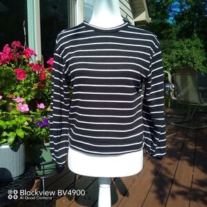 Monteau Sweater featuring thin white stripes on a black background - size small